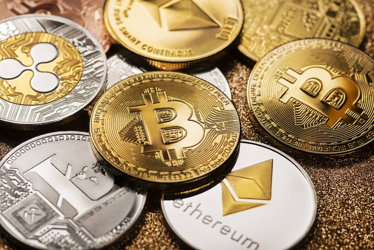 Top Cryptocurrencies Bitcoin, Litecoin, XRP, Ethereum coins lying around